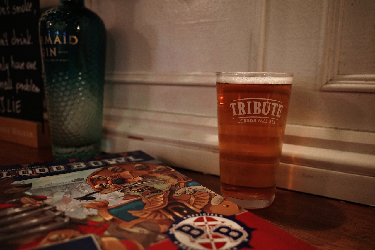 Blood Bowl rulebook at a pub